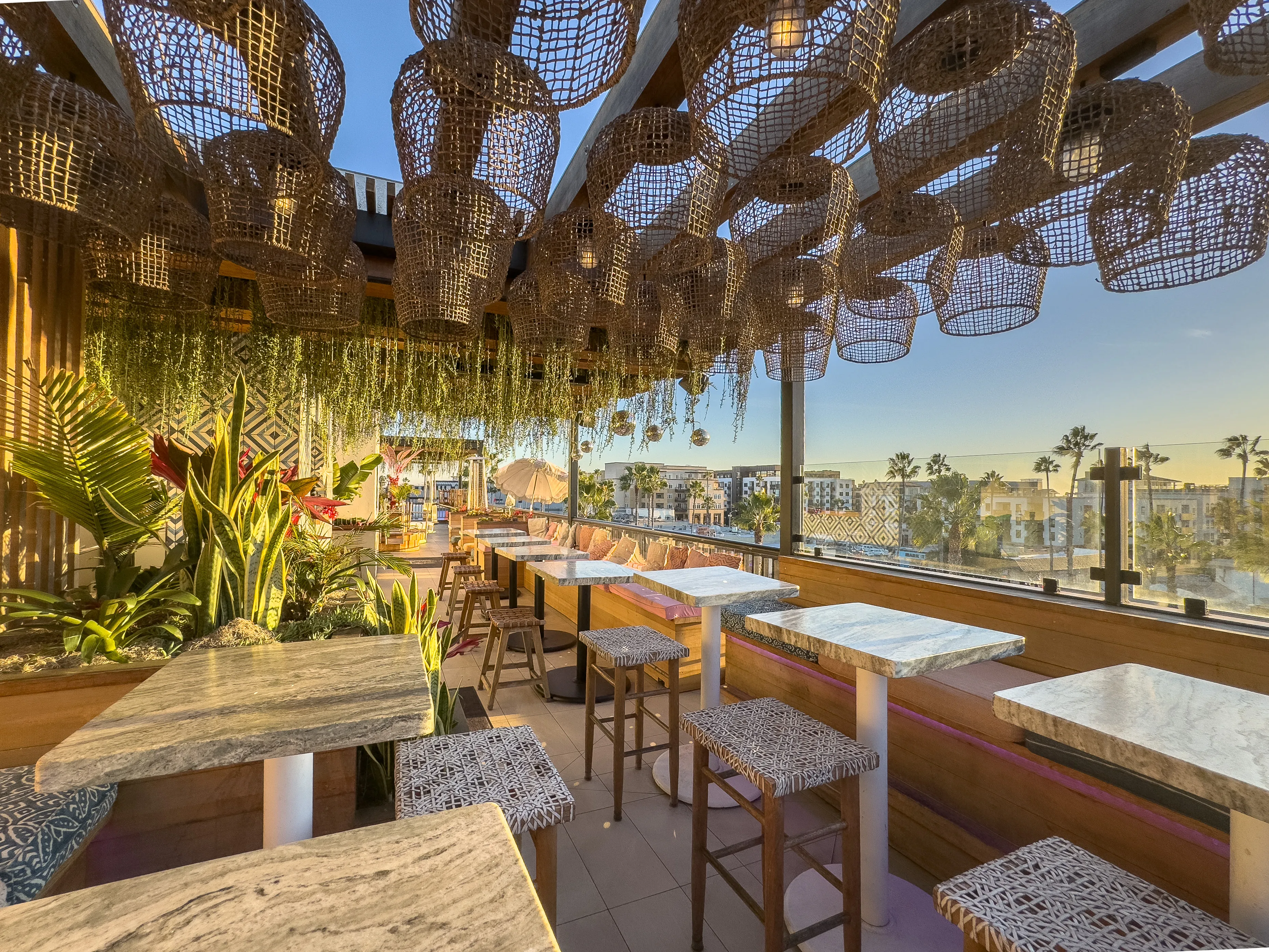 Cococabana lounge area with open air,  geometric tile wall, and Oceanside city views
