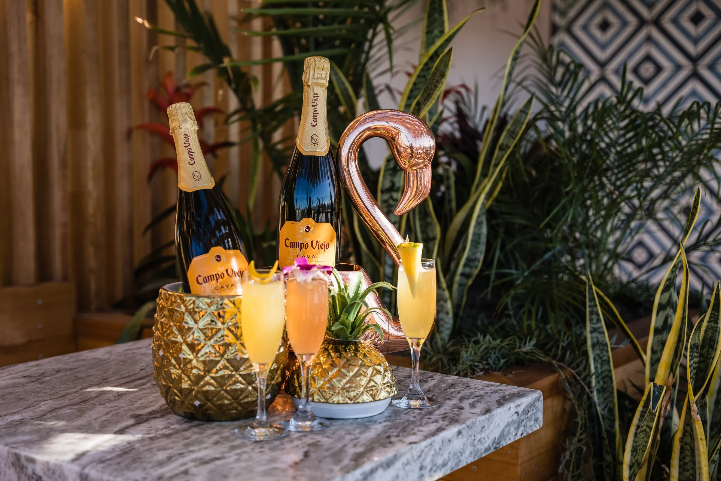 Cococabana mimosas — Campo Viejo cava flights with copper flamingo, marble table, tile wall