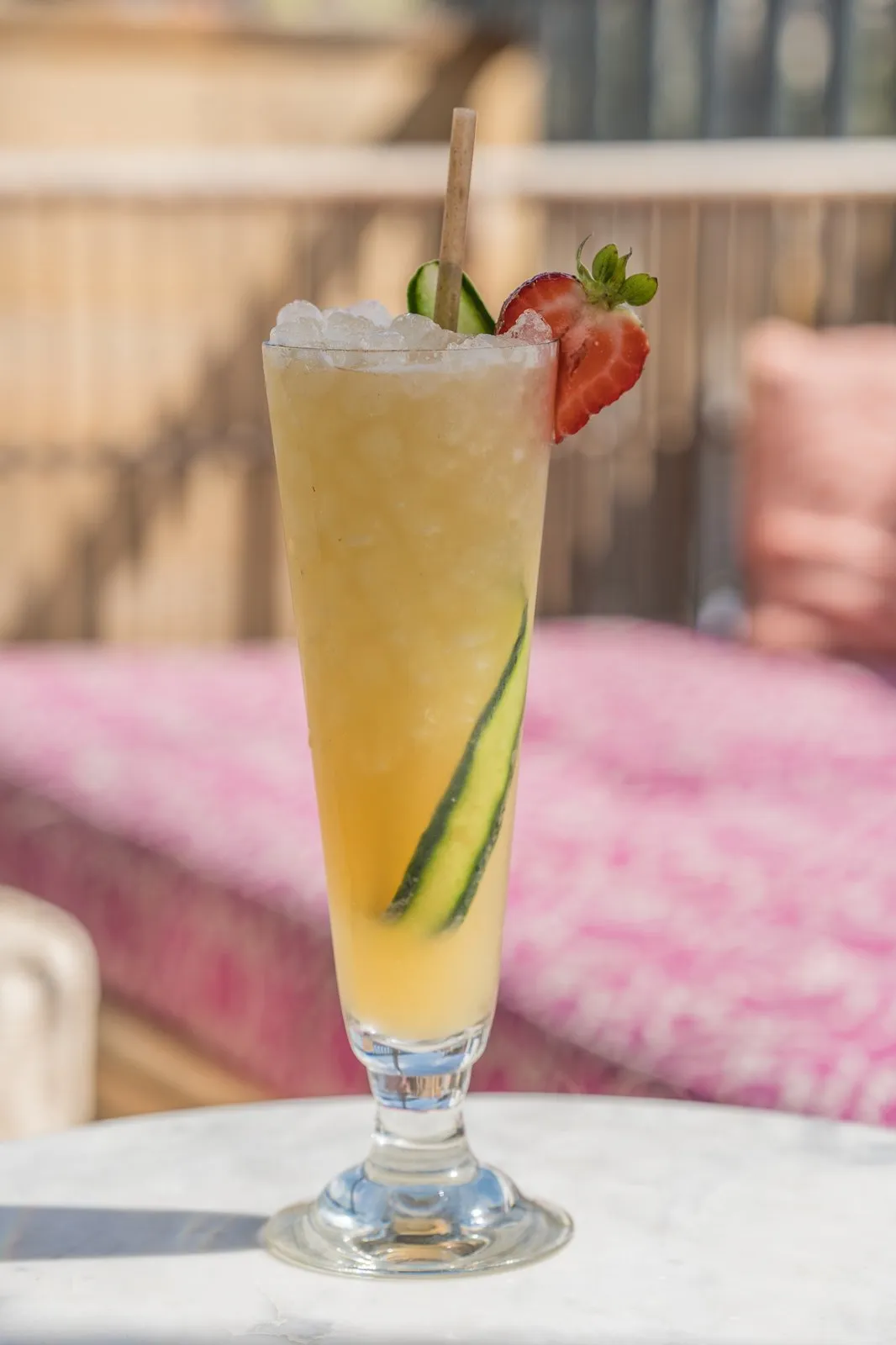 Swedish Bikini Team cocktail with cucumber ribbon and strawberry