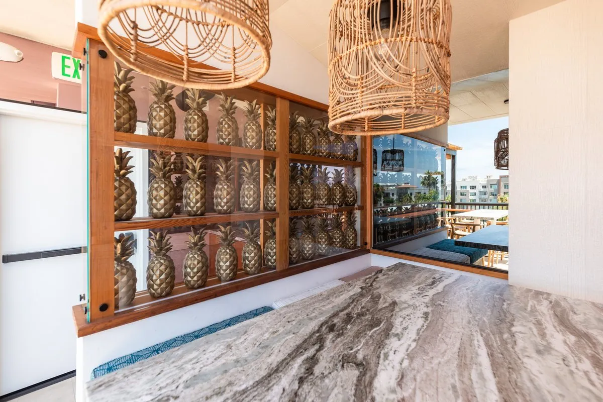 Gold pineapple wall display at Coco Cabana bar