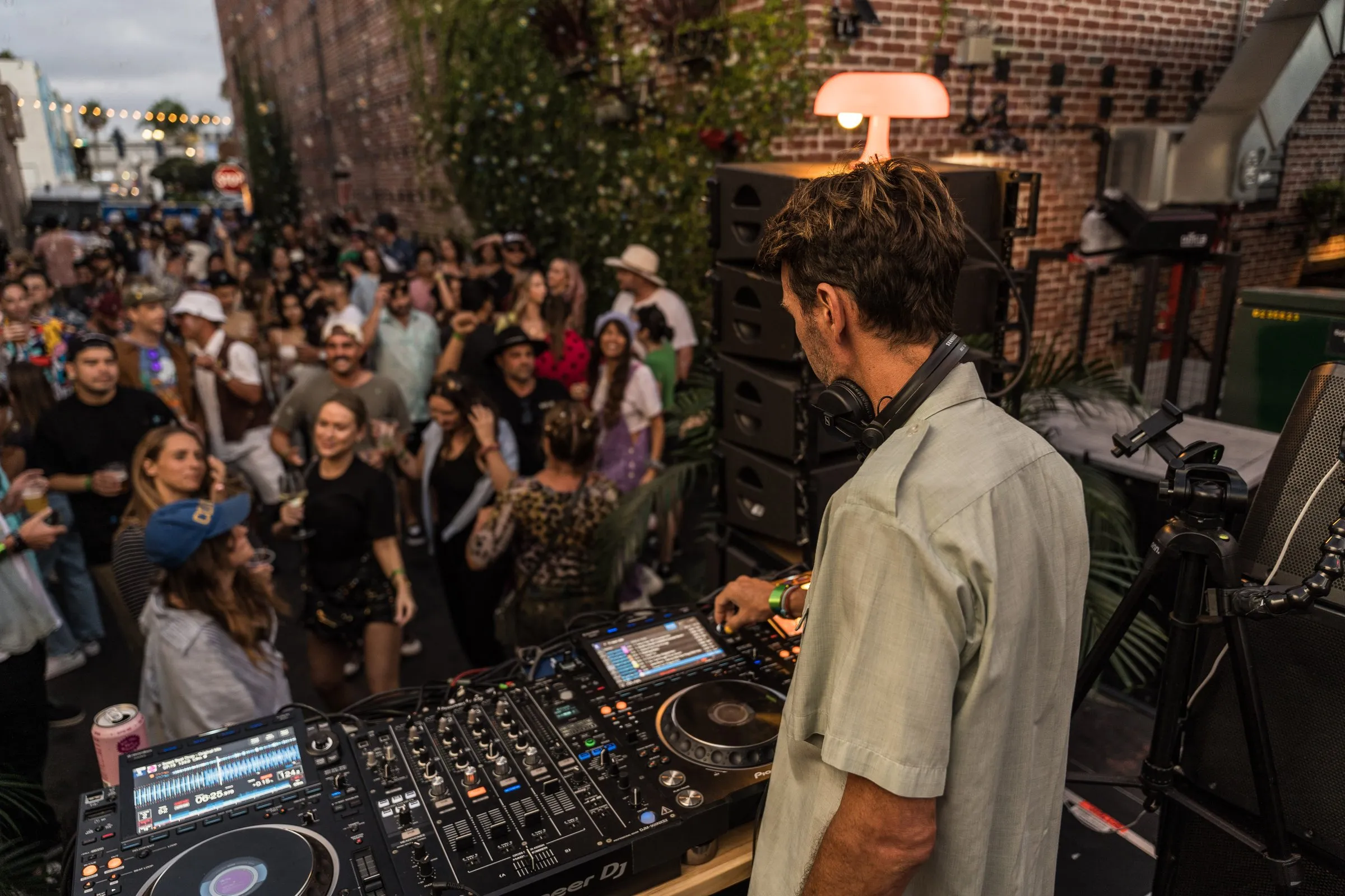 DJ set at Cococabana with crowd on the rooftop